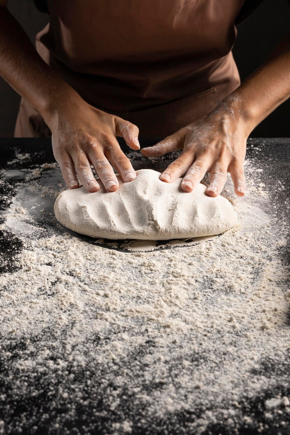 chef-kneading-dough-table_23-2148742165